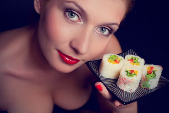 girl holding sushi