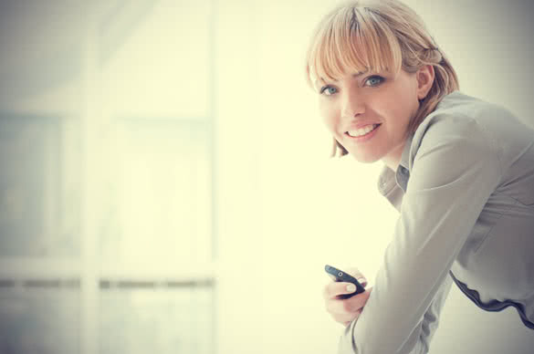 businesswoman holding cell phone