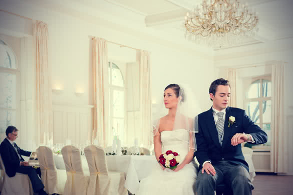Bridal couple waiting for ceremony in a decorated hall