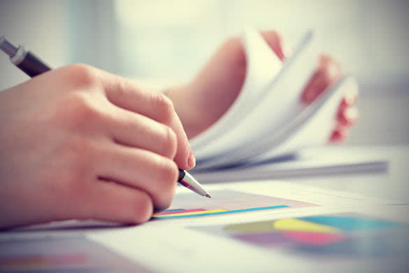 woman writing a business proposal