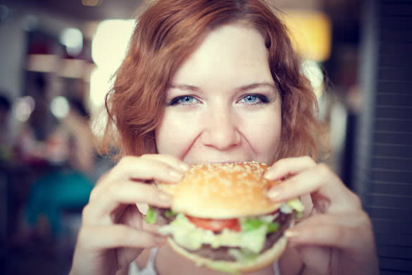 Short Hair Woman eating Fast Food