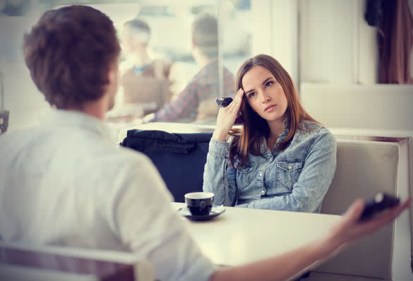 arguing couple in coffee shop