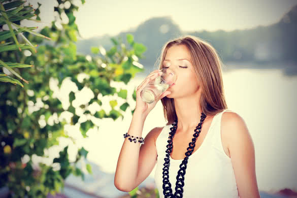 pretty woman drinking glass of water