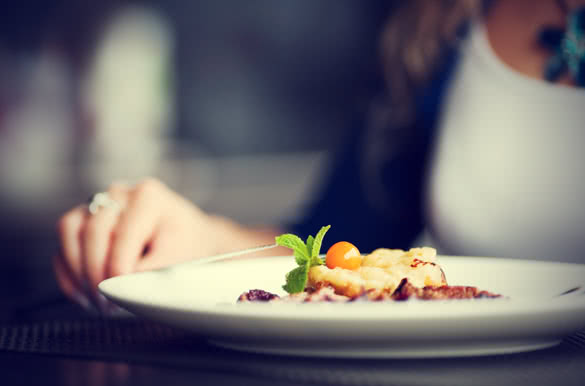 Woman siting at dinner table