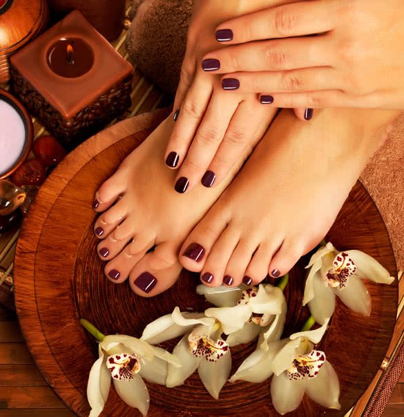 closeup photo of a female feet at spa salon on pedicure