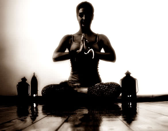 short hair woman meditating at home