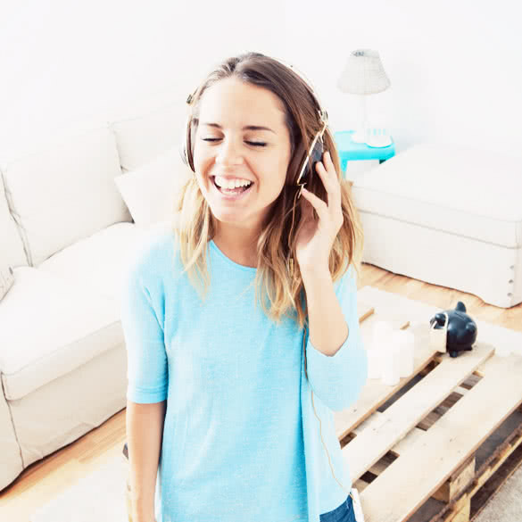 smiling young woman listening music