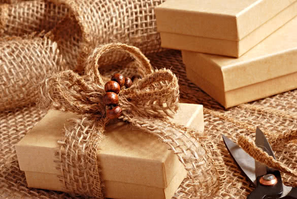 Gift wrapping still life with small brown boxes