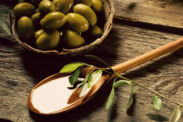olive oil over spoon