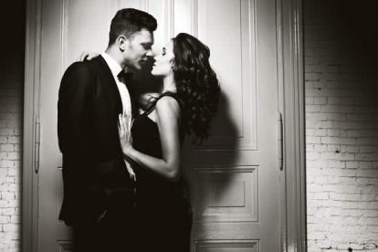 Nice elegant couple next to the door