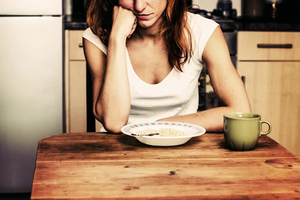 Young woman hates cereal