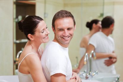 Couple hugging in the bathroom