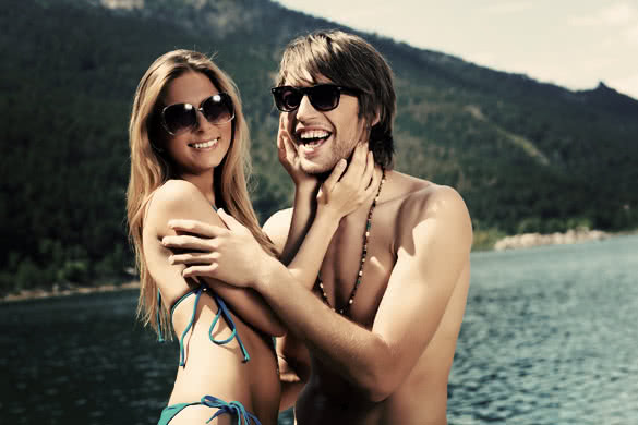 Happy young couple having a rest on a beach