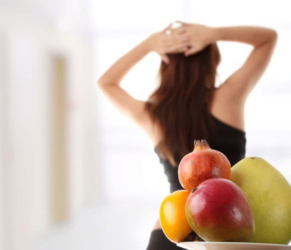 Healthy fruits with fitness girl