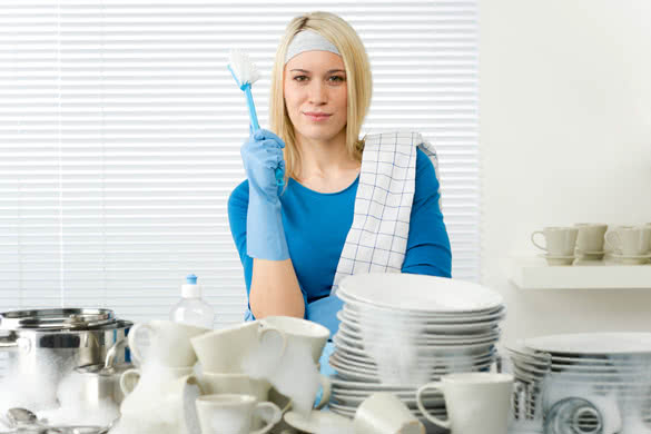 happy woman washing dishes