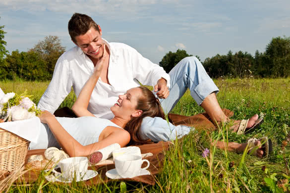 Young couple in spring meadow
