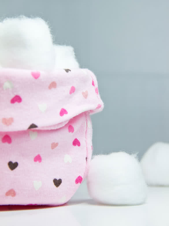 cotton-balls-for-removing-nail-polish-in-pink-basket-with-hearts