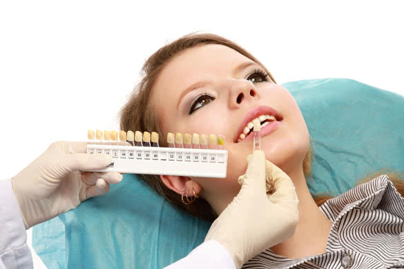 Examining patients teeth