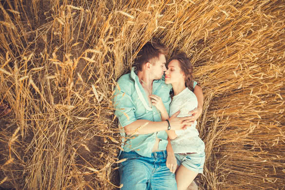 Young couple in love outdoor in summer in field