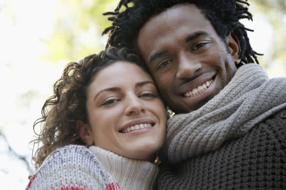 happy young multiethnic couple smiling