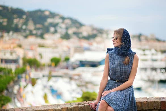 Elegant young woman in the Old town of Cannes