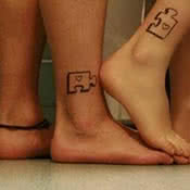 Small Puzzle Pieces Couples Tattoo