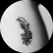 Small Dolphin Tattoo Design: Rib Cage Middle