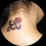 Small Lady Bug Tattoo Design: Back of Neck In Color