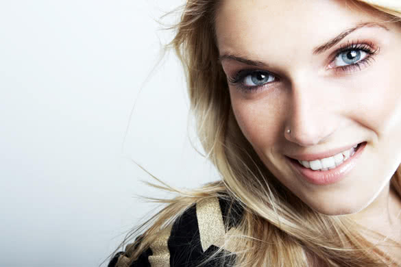 smiling beautiful blonde caucasian woman with blue eyes