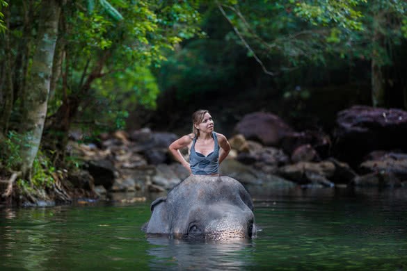 the girl with the elephant in the water