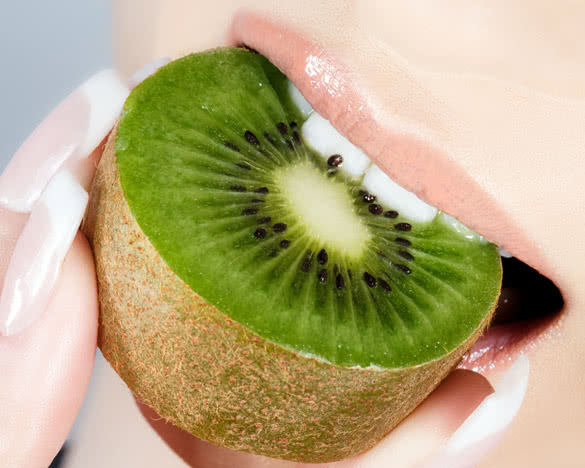 Beautiful lips and delicious kiwi