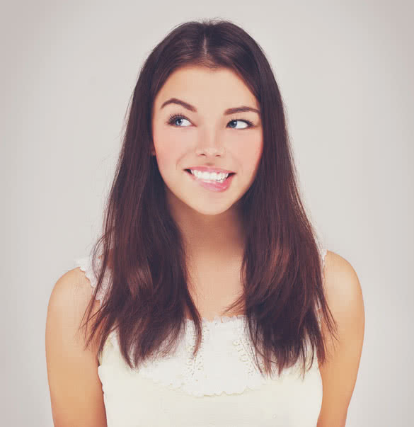 Beauty portrait of a young brunette woman with beautiful smile