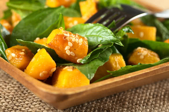 Baked pumpkin spinach and sesame salad