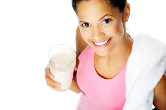 fit young woman with refreshing smoothie