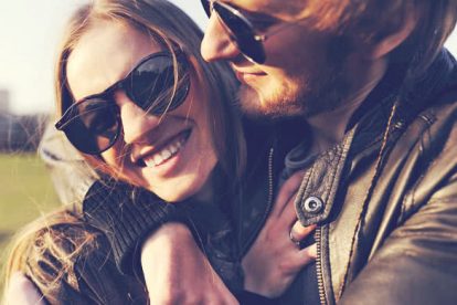 Loving and happy couple embracing and laughing