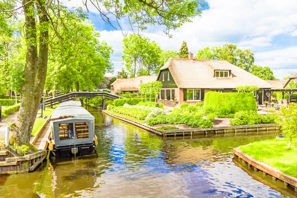 Typical Dutch houses and gardens in Giethoorn