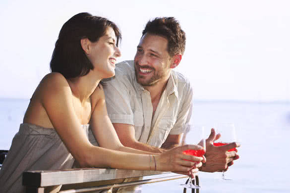 Couple having a spritz time with a lake view