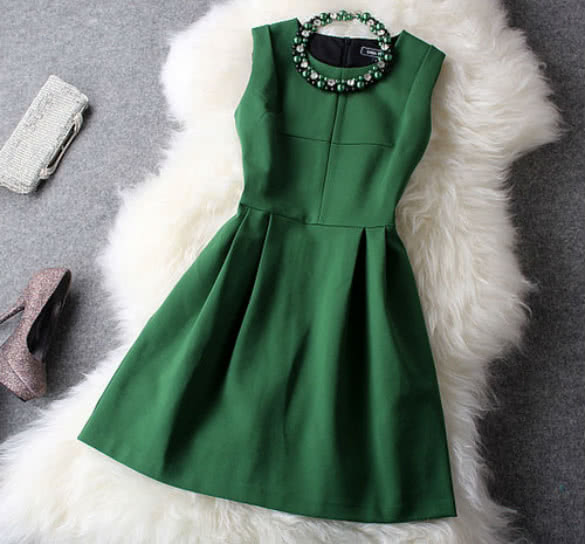 Green classy dress matched with green necklace