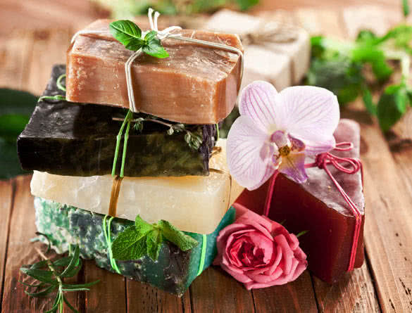 Pieces of natural soap with herbs and flowers