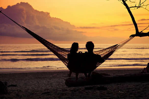 couple-watching-sunset-on-the-beach