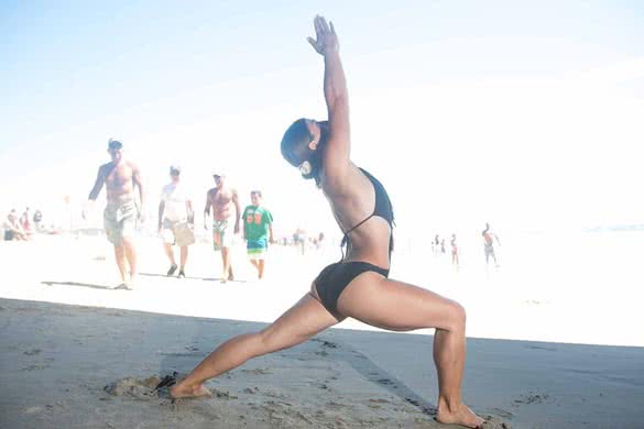 yoga-Warrior-1-pose-on-the-beach