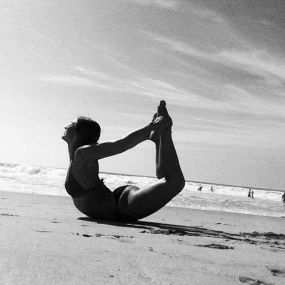 yoga-pose-bow-on-the-beach