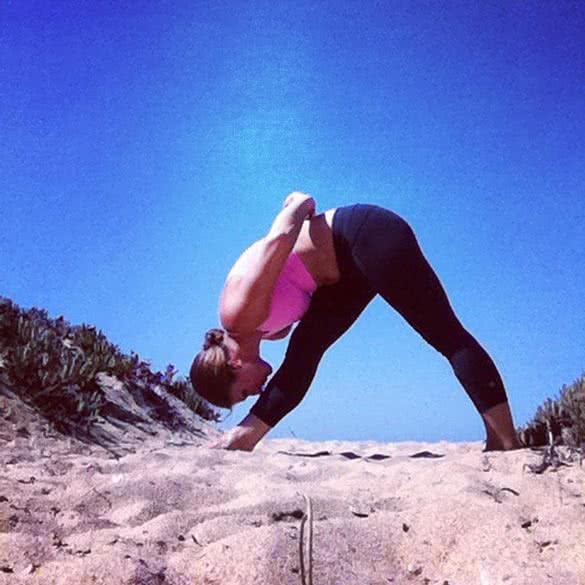 yoga-pyramid-pose-on-the-beach