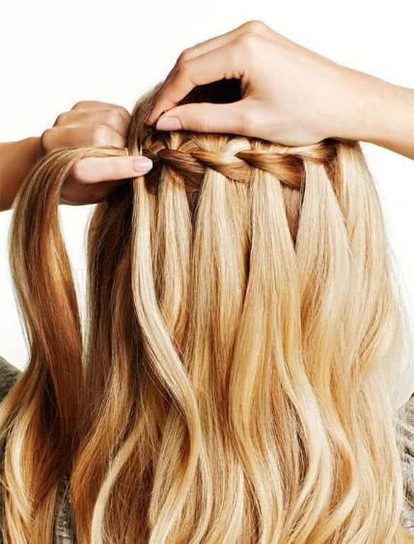 blonde-hair-making-waterfall-braid