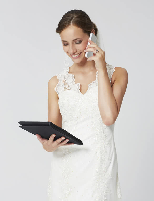 future-bride-talking-on-the-phone-and-planning-wedding