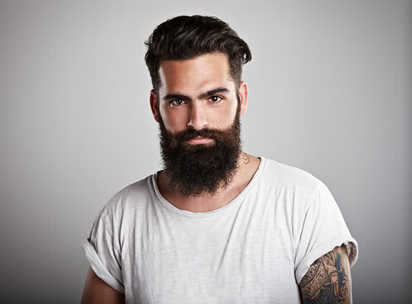 man-with-black-beard-and-tattoos