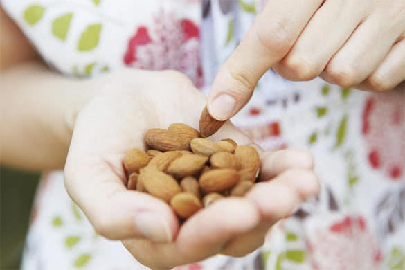 woman-holding-almonds