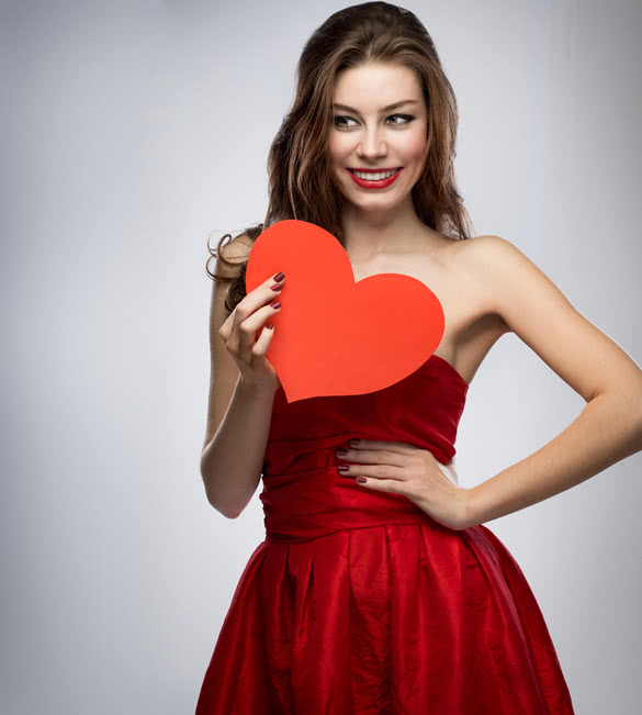 woman-in-red-dress-holding-heart