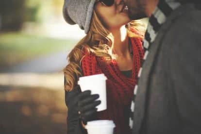 Young people kissing outdoors