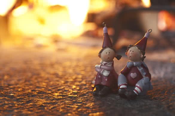 christmas puppets near a fireplace